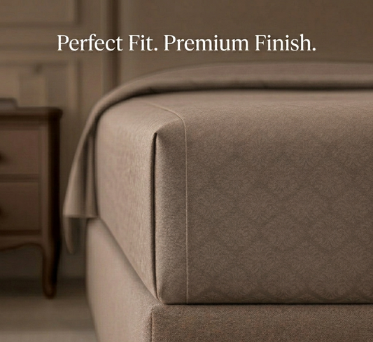 Close-up of a brown upholstered piece of furniture with 'Perfect Fit. Premium Finish.' text.