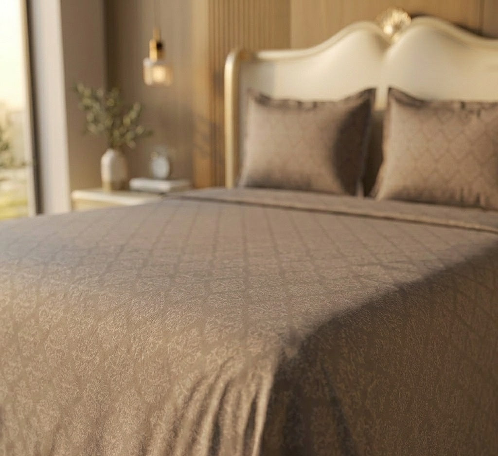 Neatly made bed with beige bedding in a bedroom setting