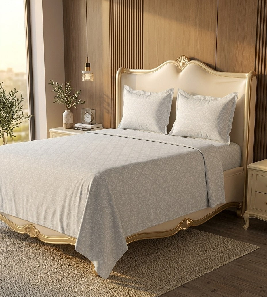Neatly made bed with beige bedding in a bedroom setting