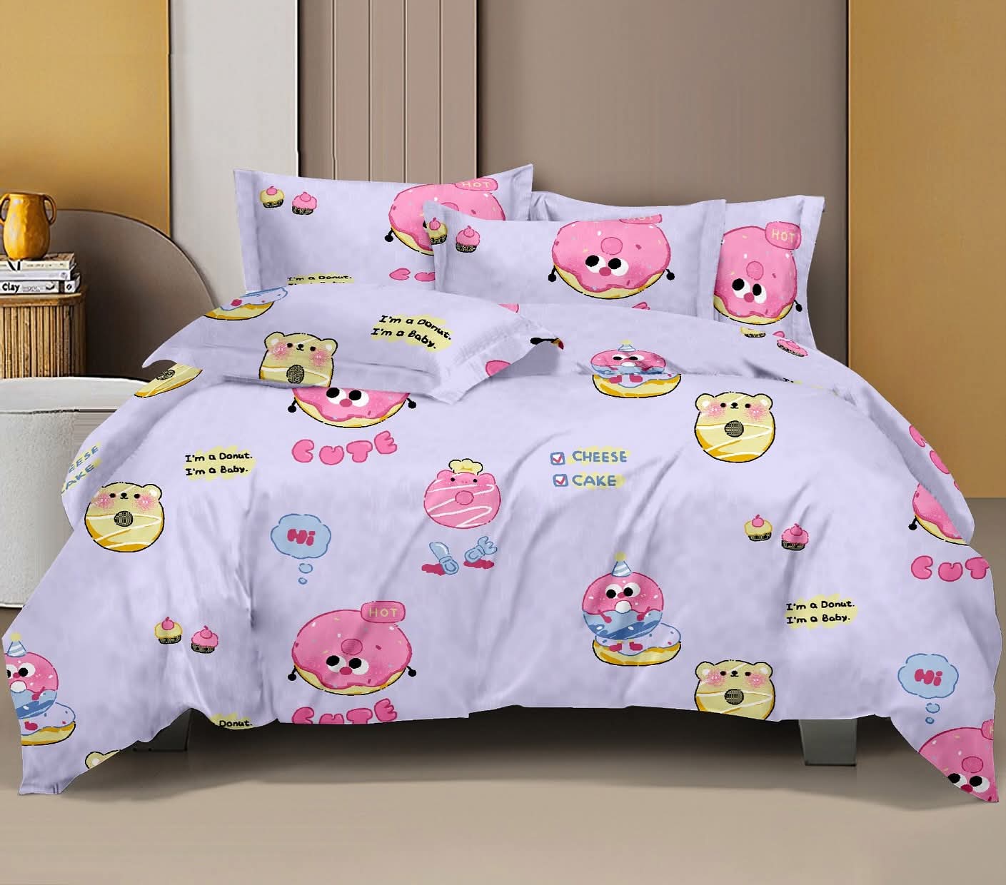 Bedding set with cartoon character design on a bed in a room.